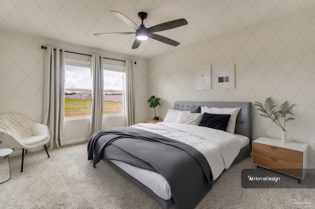 bedroom featuring ceiling fan and tile walls