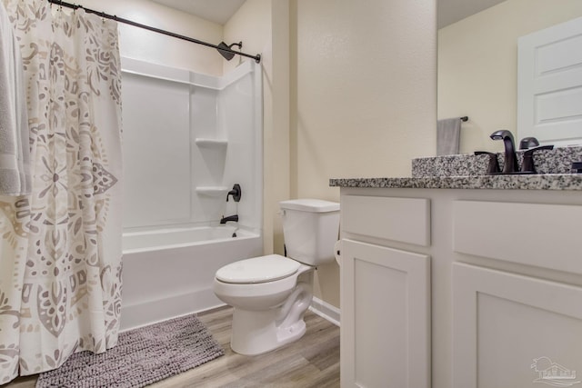 full bathroom featuring vanity, shower / bath combination with curtain, wood finished floors, and toilet