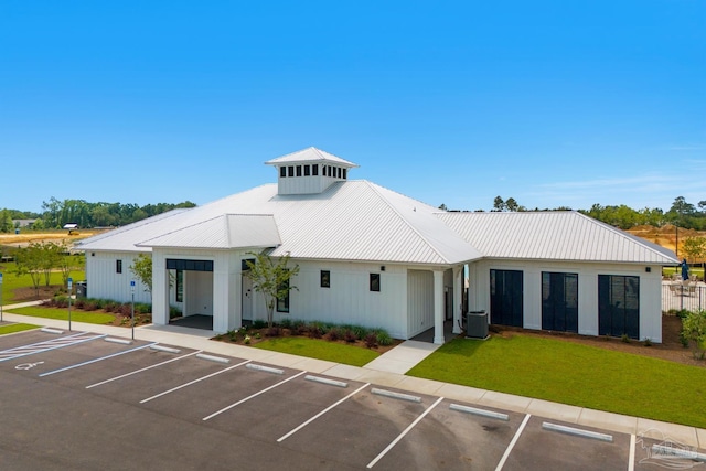 view of property featuring a carport and cooling unit