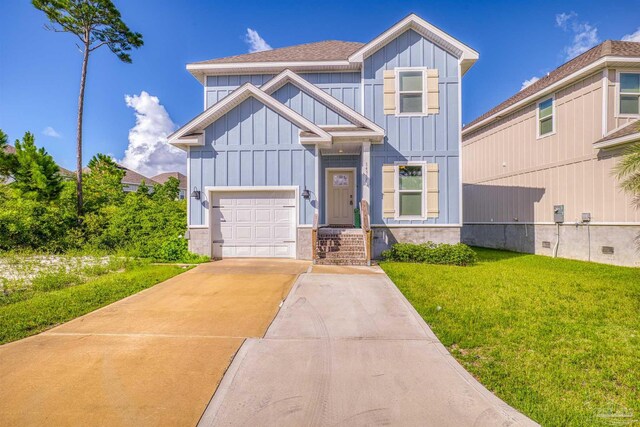 view of front of house featuring a garage and a front lawn