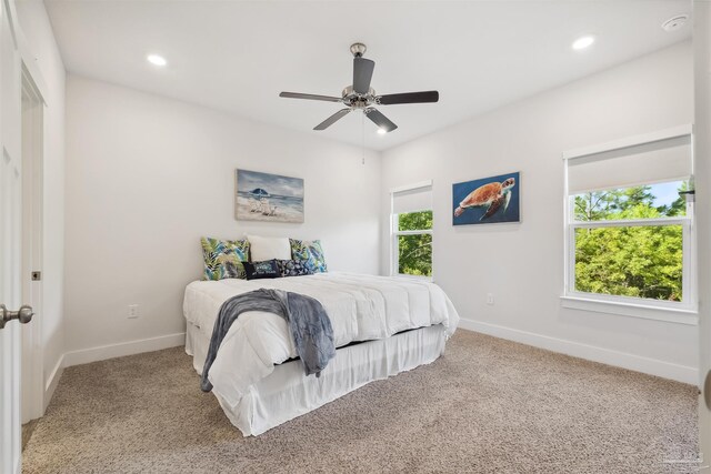 carpeted bedroom with ceiling fan