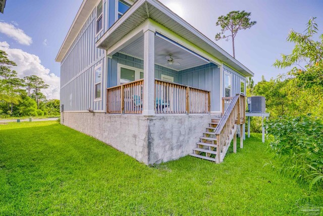 rear view of house featuring a wooden deck, central air condition unit, a yard, and ceiling fan