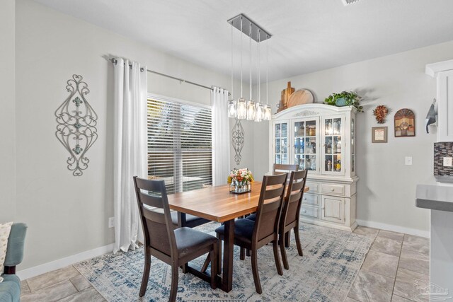 dining space with baseboards