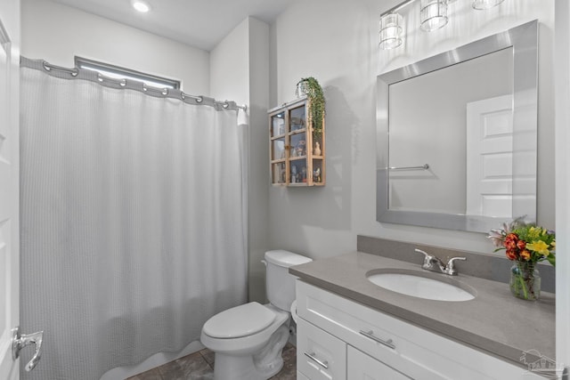 bathroom with toilet, tile patterned flooring, shower / bath combination with curtain, and vanity