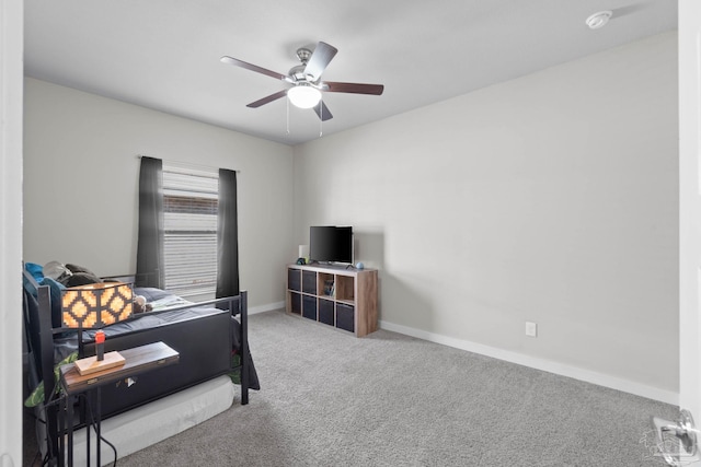 bedroom with carpet floors, a ceiling fan, and baseboards