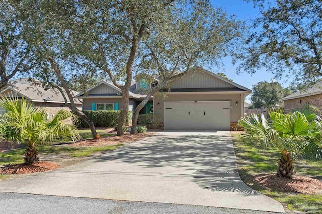 view of front of property with a garage and concrete driveway