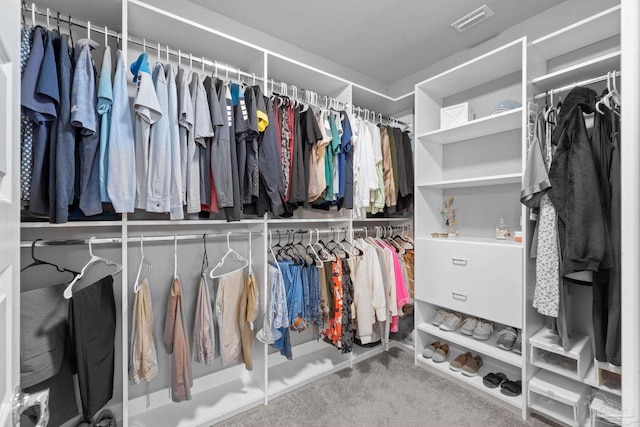 walk in closet with carpet and visible vents