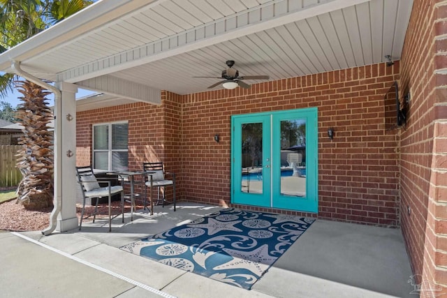 view of patio / terrace with french doors and a ceiling fan