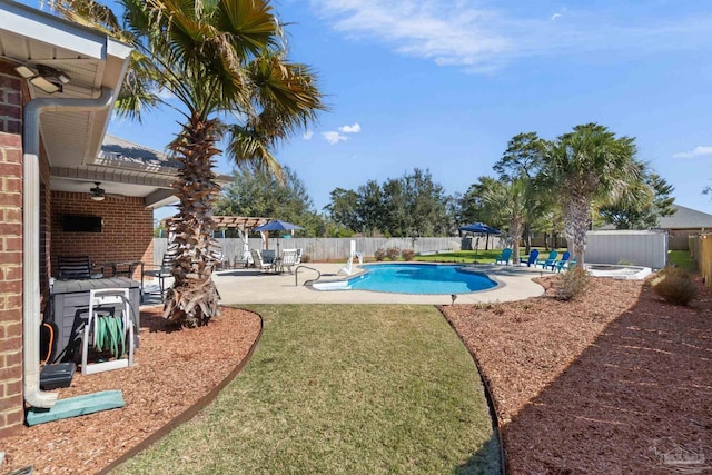 view of pool featuring a patio area, a fenced backyard, a lawn, and a fenced in pool