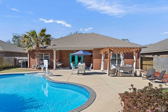 view of swimming pool with a patio area, a fenced backyard, a fenced in pool, and a pergola