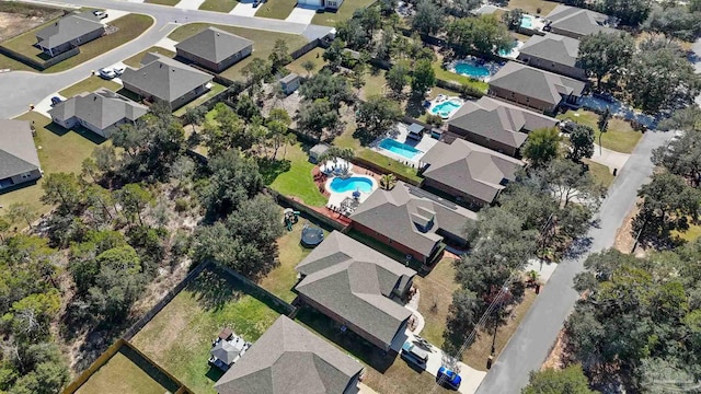 birds eye view of property with a residential view