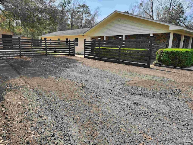 3111 Zepp Ln, Pace, FL 32571 - view of side of home with a fenced front yard