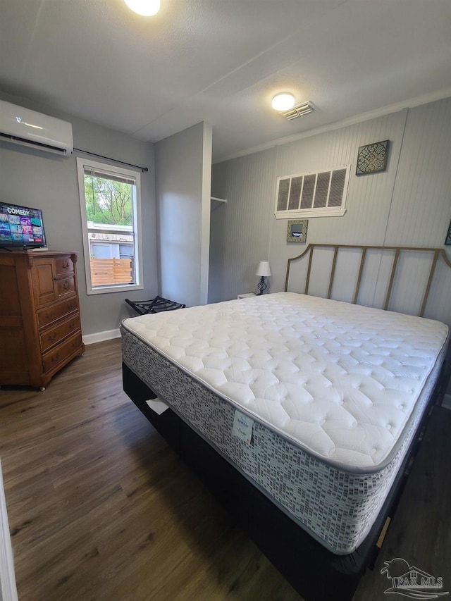 3111 Zepp Ln, Pace, FL 32571 - bedroom with a wall unit AC, dark wood-style floors, and an AC wall unit