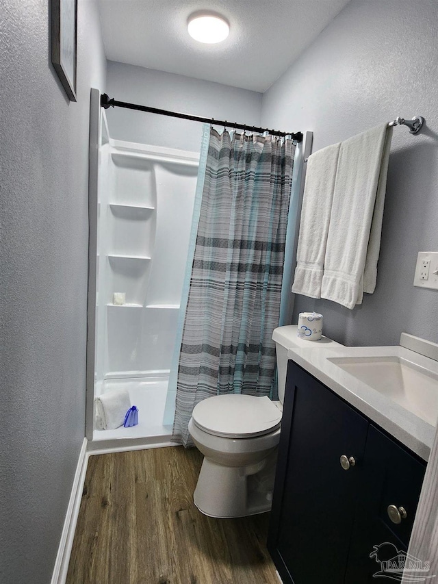 3111 Zepp Ln, Pace, FL 32571 - bathroom with wood finished floors, a shower with curtain, vanity, and a textured wall