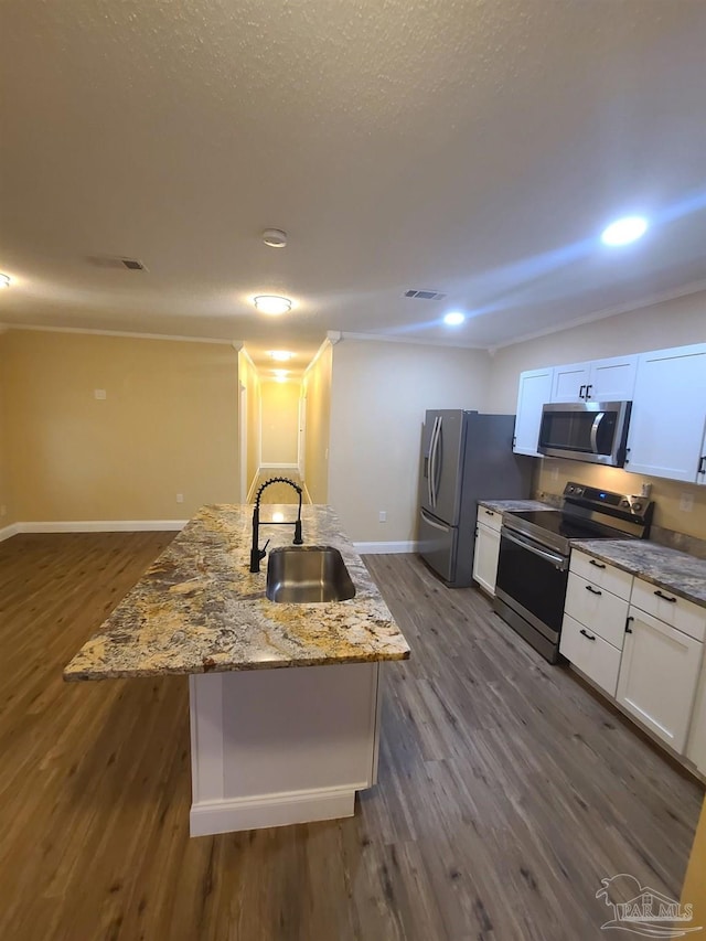 3111 Zepp Ln, Pace, FL 32571 - kitchen with stainless steel appliances, dark wood finished floors, white cabinetry, light stone counters, and recessed lighting