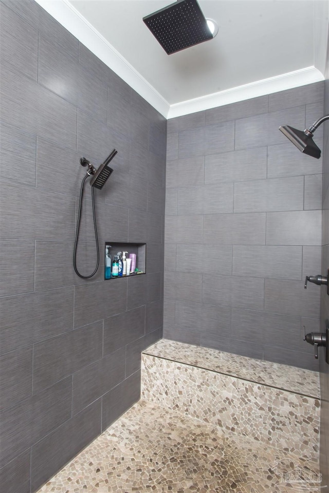 bathroom with tiled shower