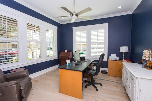 office area featuring a wealth of natural light, a ceiling fan, crown molding, and light wood-style floors