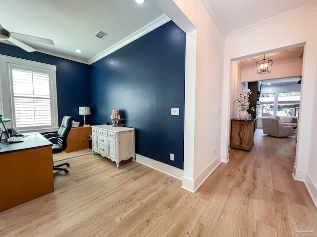 office area featuring visible vents, baseboards, ornamental molding, and light wood finished floors