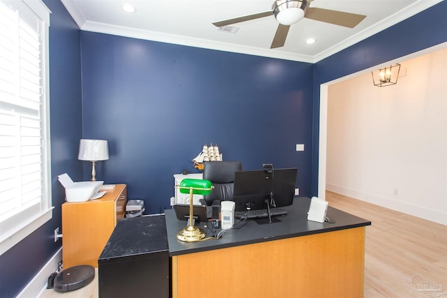 office space featuring a wealth of natural light, visible vents, wood finished floors, and ornamental molding