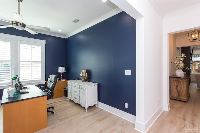 office with light wood-style floors, a ceiling fan, visible vents, and ornamental molding