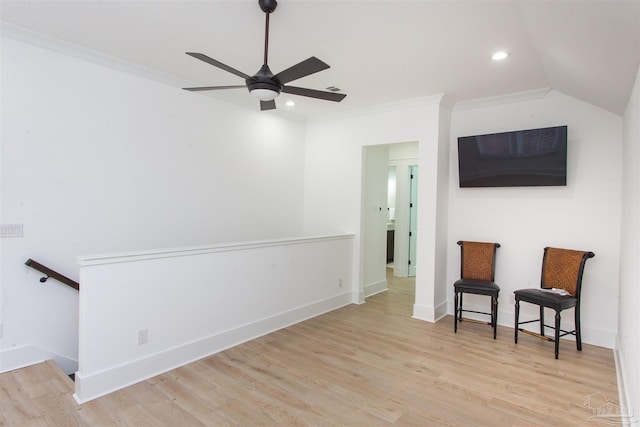 sitting room featuring ornamental molding, wood finished floors, baseboards, and ceiling fan