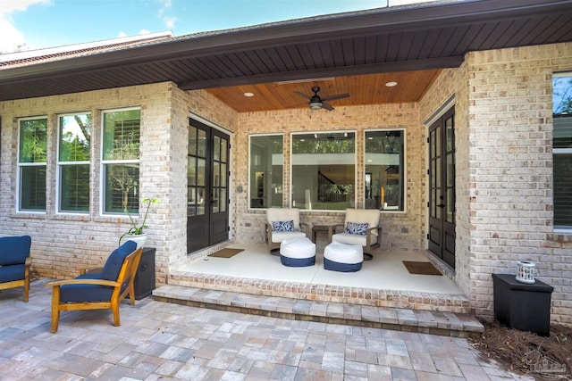 view of patio with french doors and ceiling fan