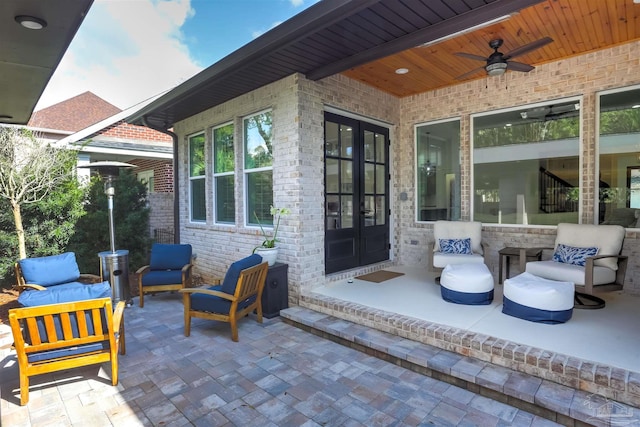 view of patio featuring french doors and a ceiling fan