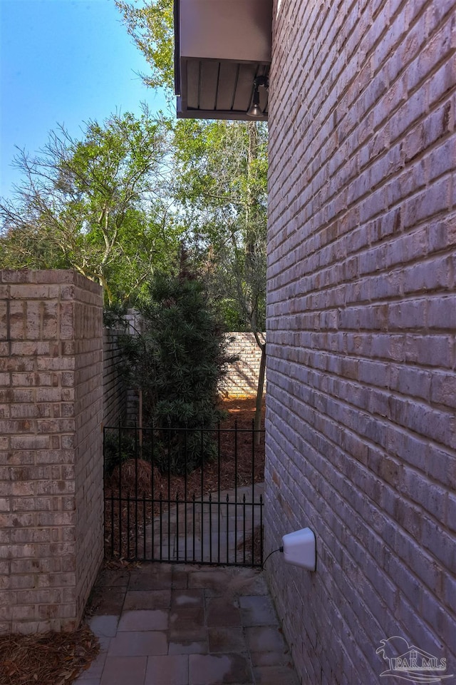 view of gate with fence