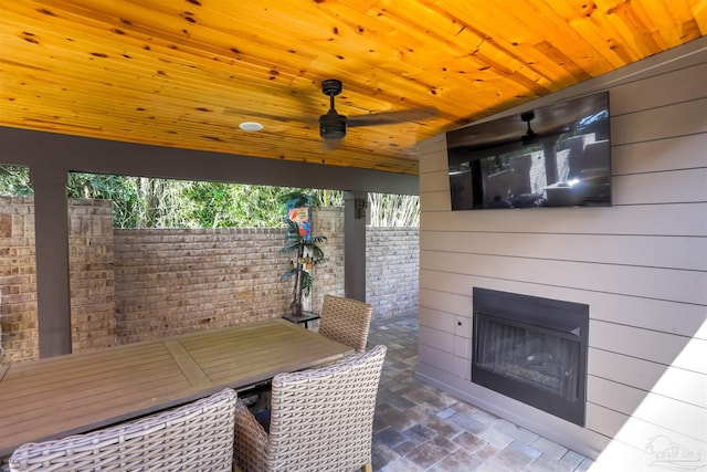 view of patio / terrace featuring a glass covered fireplace