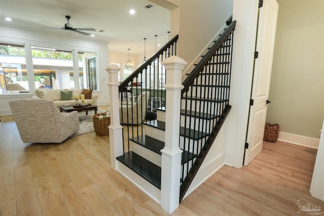 stairway with visible vents, baseboards, ceiling fan, recessed lighting, and wood finished floors