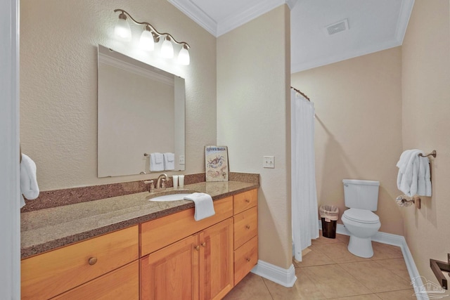 bathroom with vanity, toilet, ornamental molding, and tile patterned flooring