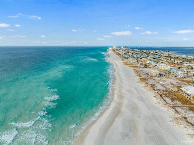 aerial view featuring a water view and a beach view