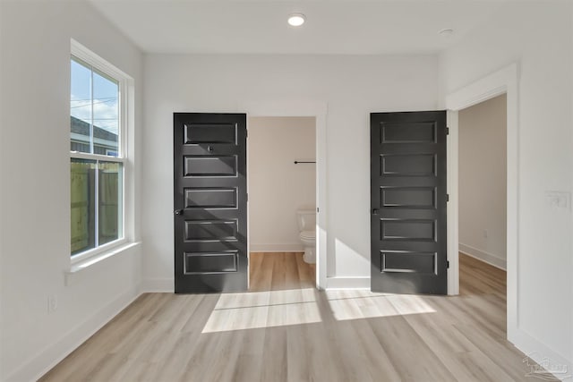 2116 W De Soto St, Pensacola, FL 32505 - unfurnished bedroom with light wood-style flooring, baseboards, and recessed lighting