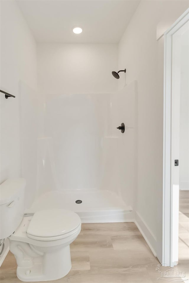 2116 W De Soto St, Pensacola, FL 32505 - bathroom featuring toilet, a shower, wood finished floors, and recessed lighting