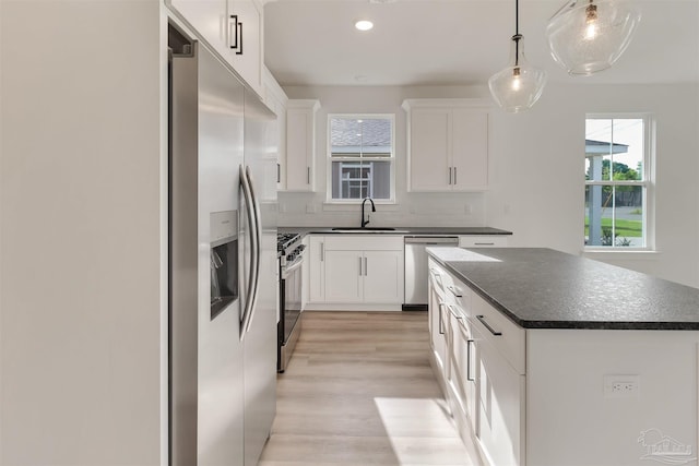2116 W De Soto St, Pensacola, FL 32505 - kitchen with appliances with stainless steel finishes, a sink, dark countertops, healthy amount of natural light, and recessed lighting