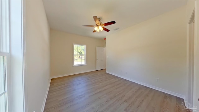 unfurnished room with ceiling fan and light hardwood / wood-style floors