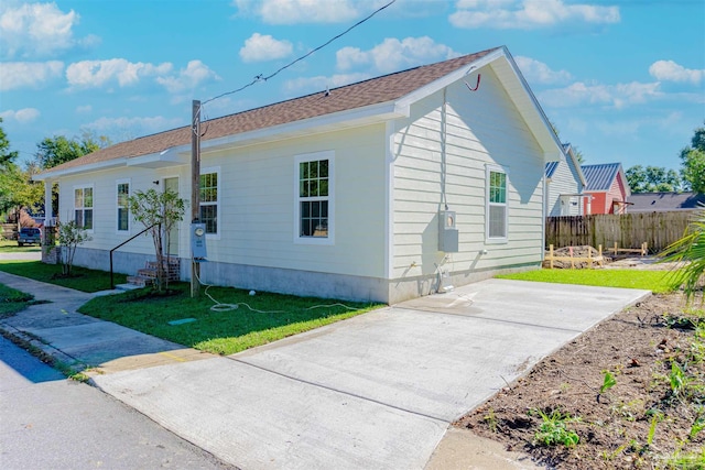 view of property exterior with a yard