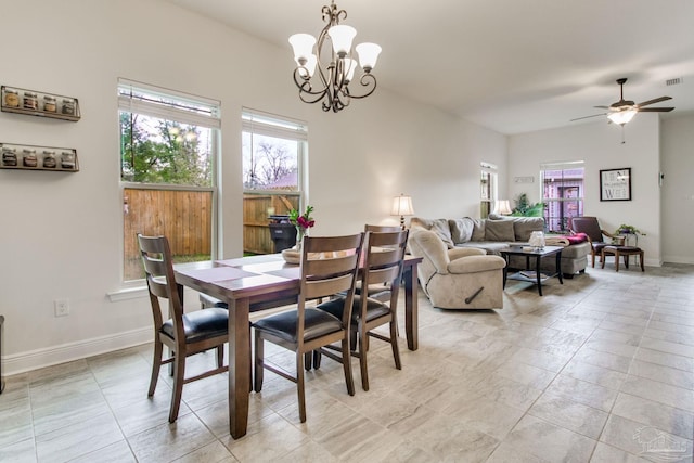 dining space featuring visible vents, baseboards, and ceiling fan with notable chandelier