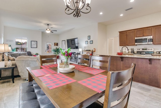 dining space with recessed lighting, visible vents, and ceiling fan with notable chandelier