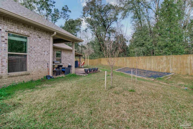 view of yard with a patio area and fence