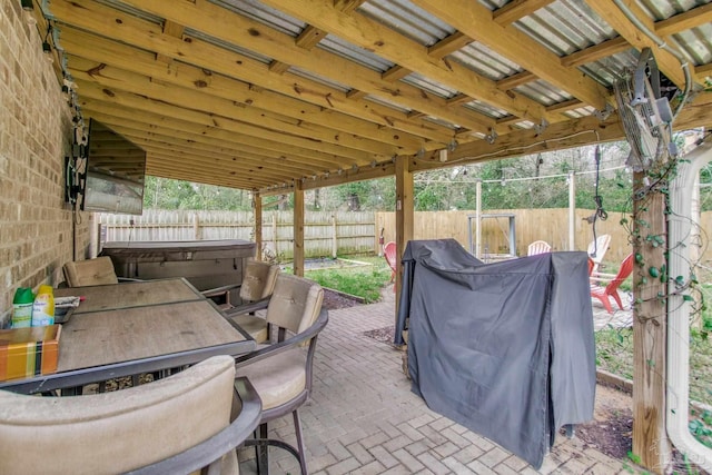 view of patio featuring a fenced backyard and outdoor dining area