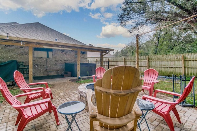 view of patio with area for grilling and fence