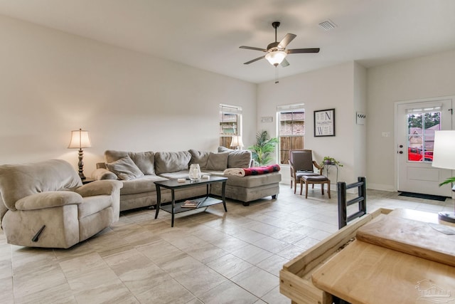 living area with visible vents and ceiling fan