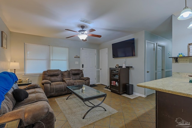 living room with light tile patterned floors and ceiling fan