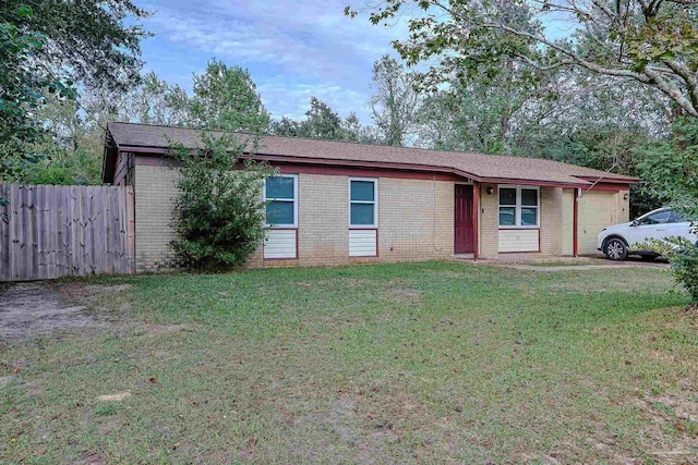 ranch-style home with a front lawn