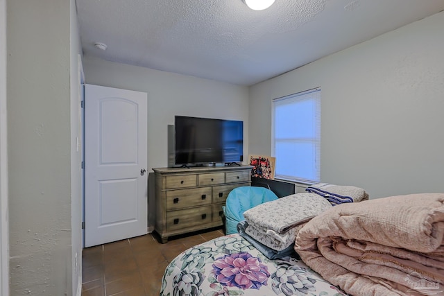 bedroom featuring a textured ceiling