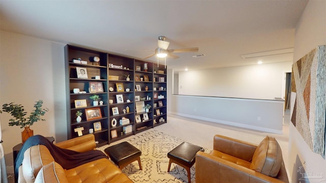 sitting room featuring ceiling fan