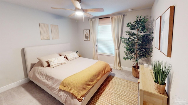 bedroom featuring ceiling fan and light colored carpet