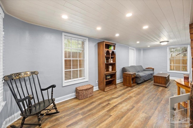 sitting room featuring hardwood / wood-style floors and wood ceiling