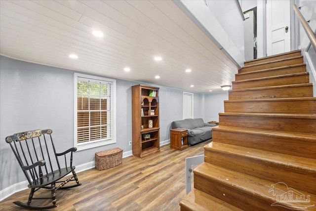 staircase with wooden ceiling and wood-type flooring